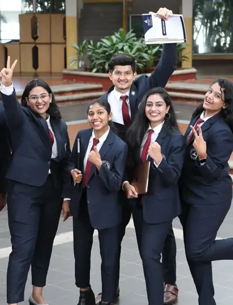 Presidency College graduates in blazers celebrating on campus